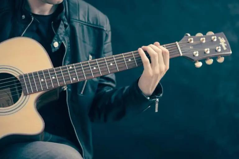Guy holding a guitar