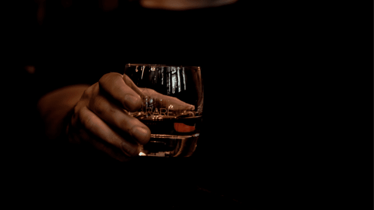 Handing a Glass of Whiskey
