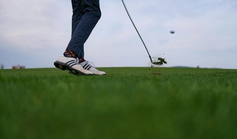 golf ball flying off tee
